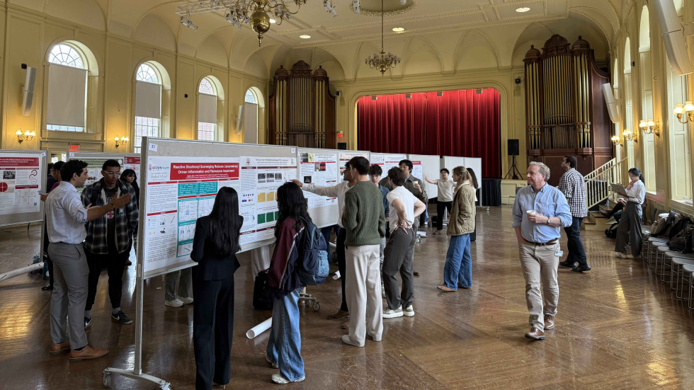 Students presenting posters during Session II in Alumnae Hall